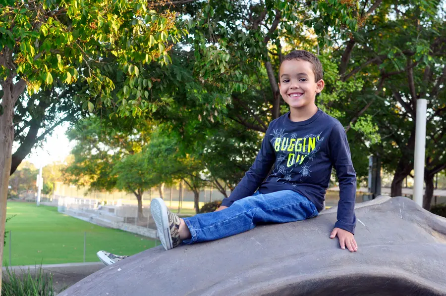 Kids showcasing their first day of school outfits in a lively setting