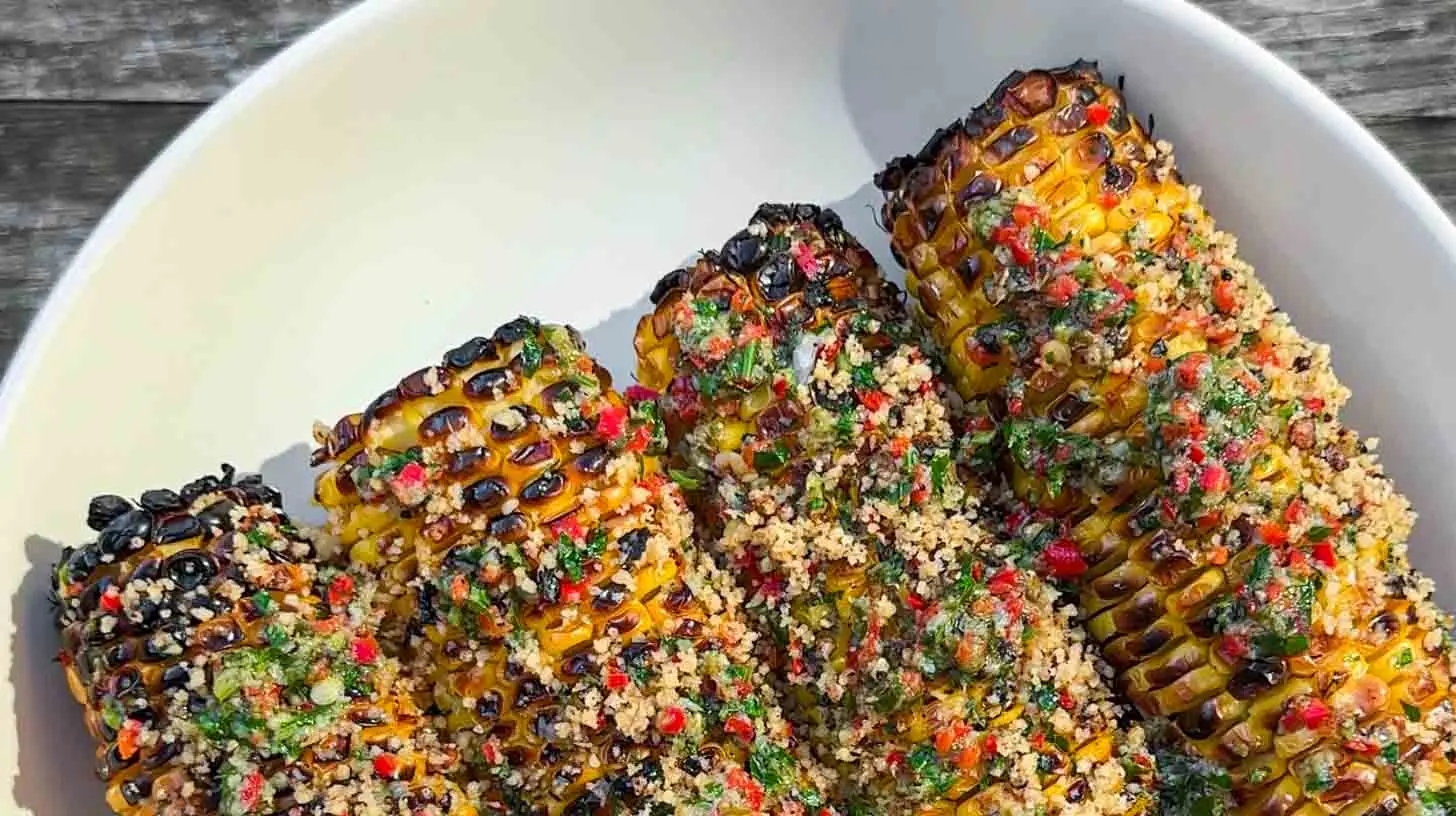 Grilled corn on the cob seasoned with a vibrant chili lime rub