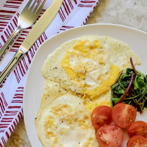 A table spread with various healthy breakfasts with simple ingredients like fruit and oats.