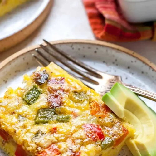 A healthy egg breakfast casserole baked with colorful vegetables.