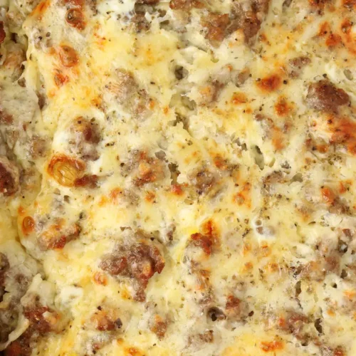 A freshly baked make ahead sausage breakfast casserole, golden brown and bubbling.
