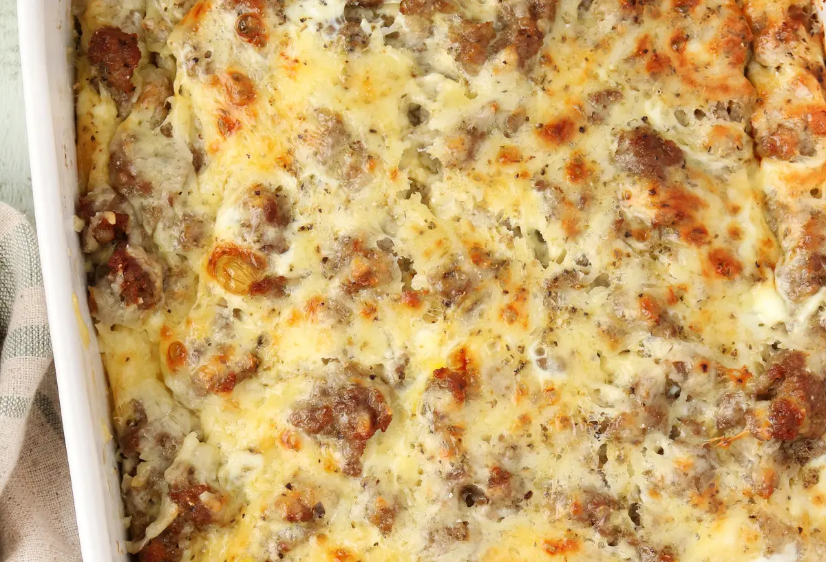 A freshly baked make ahead sausage breakfast casserole, golden brown and bubbling.
