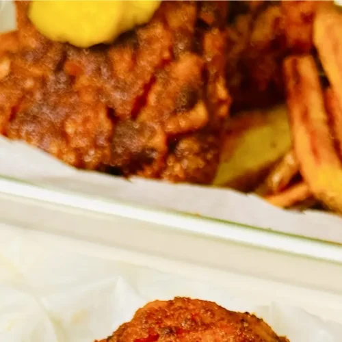 Crispy fried Nashville hot chicken with a fiery red glaze