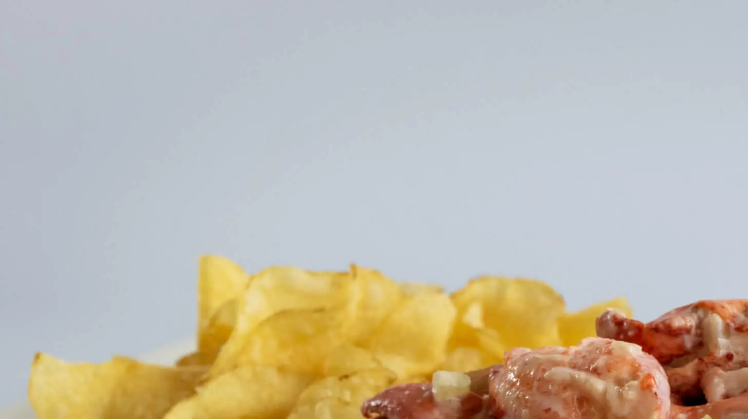 A New England lobster roll, served cold on a buttered and toasted bun, filled with fresh lobster meat