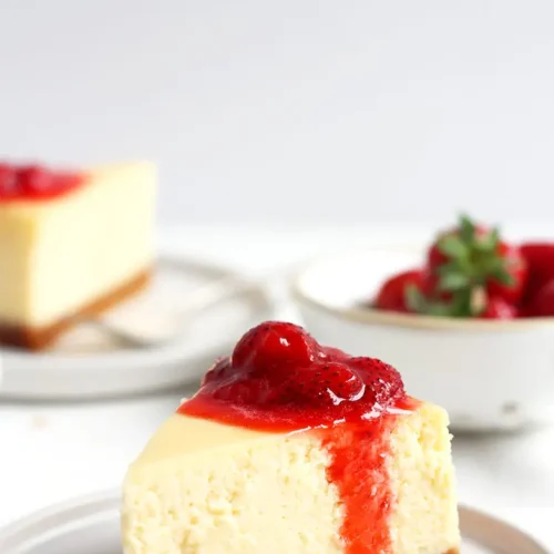 A delectable slice of classic New York cheesecake, plain and smooth.