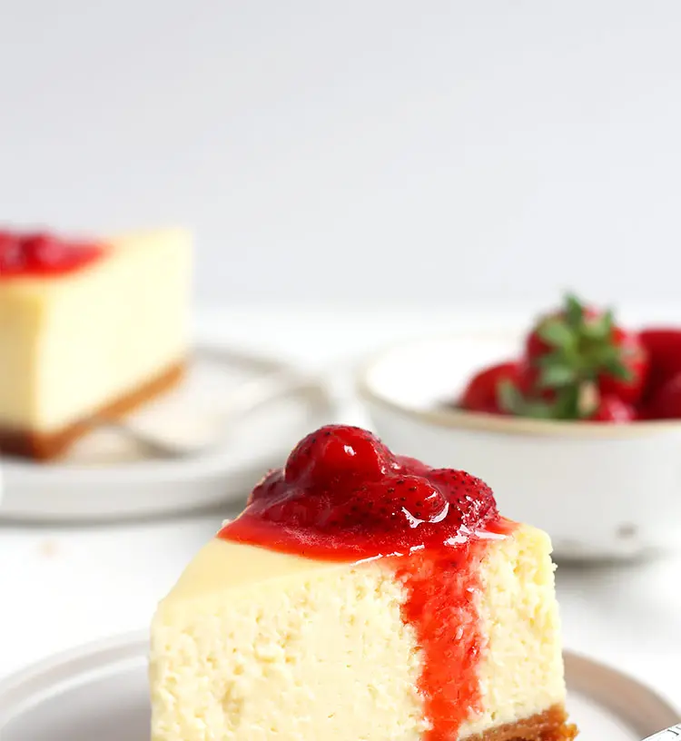 A delectable slice of classic New York cheesecake, plain and smooth.
