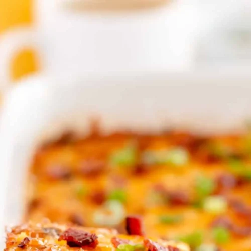 A hearty overnight breakfast casserole with eggs, cheese, and vegetables.