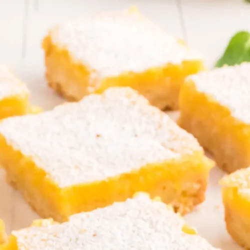 Platter of traditional Southern lemon bars dusted with powdered sugar