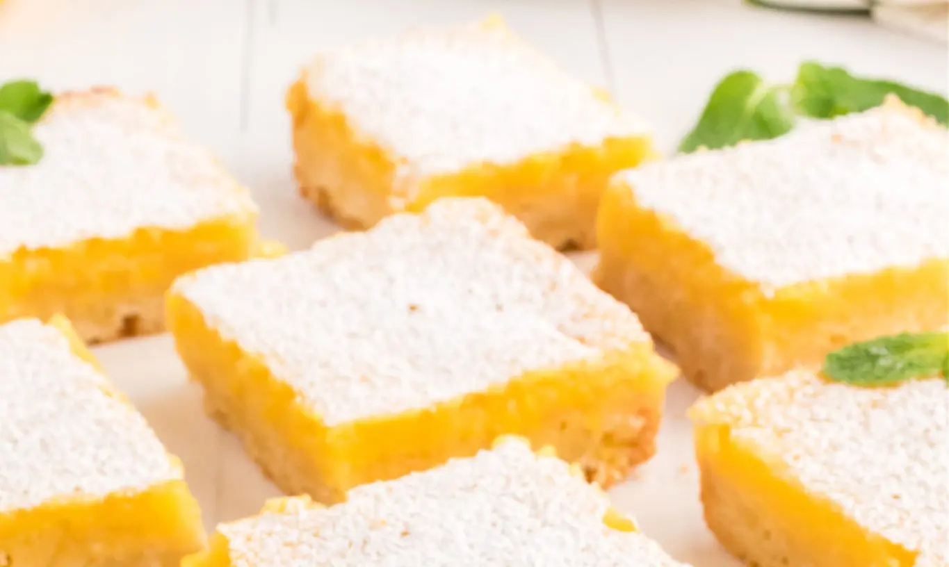 Platter of traditional Southern lemon bars dusted with powdered sugar