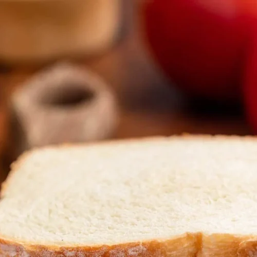 A freshly made southern tomato sandwich with ripe red tomatoes and mayonnaise