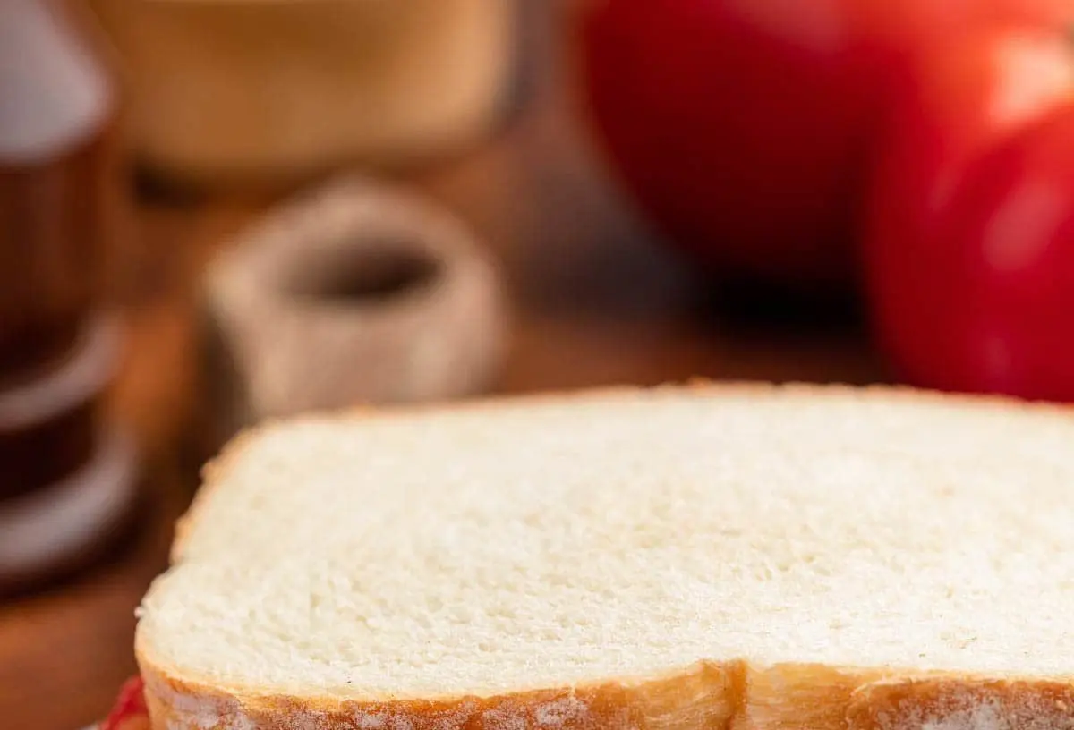 A freshly made southern tomato sandwich with ripe red tomatoes and mayonnaise