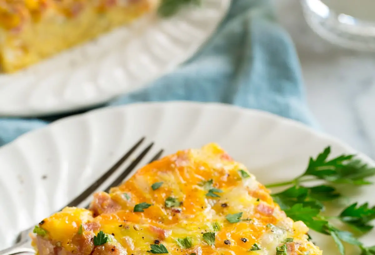 A freshly baked weekday breakfast casserole in a baking dish, ready to serve.